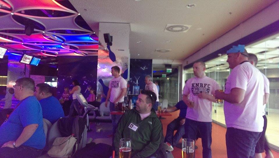 A group of friends in a bowling site in Poland drining beer and celebrating stag party
