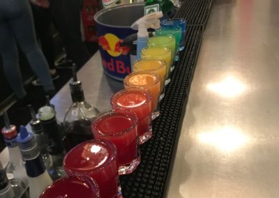 Colorful rainbow shots on a bar counter
