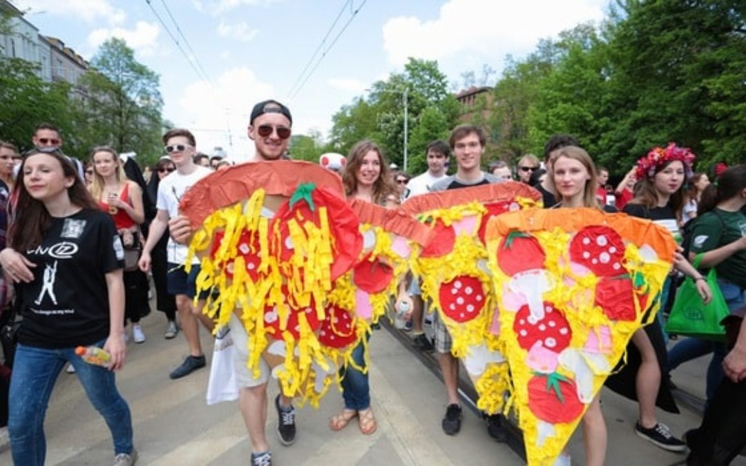 People dress up on a parade in Poland as pizza slices
