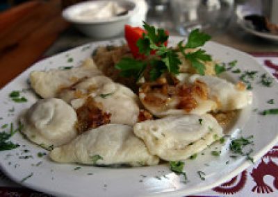 Plate of a traditional polish pierogi with cheese and potatoes